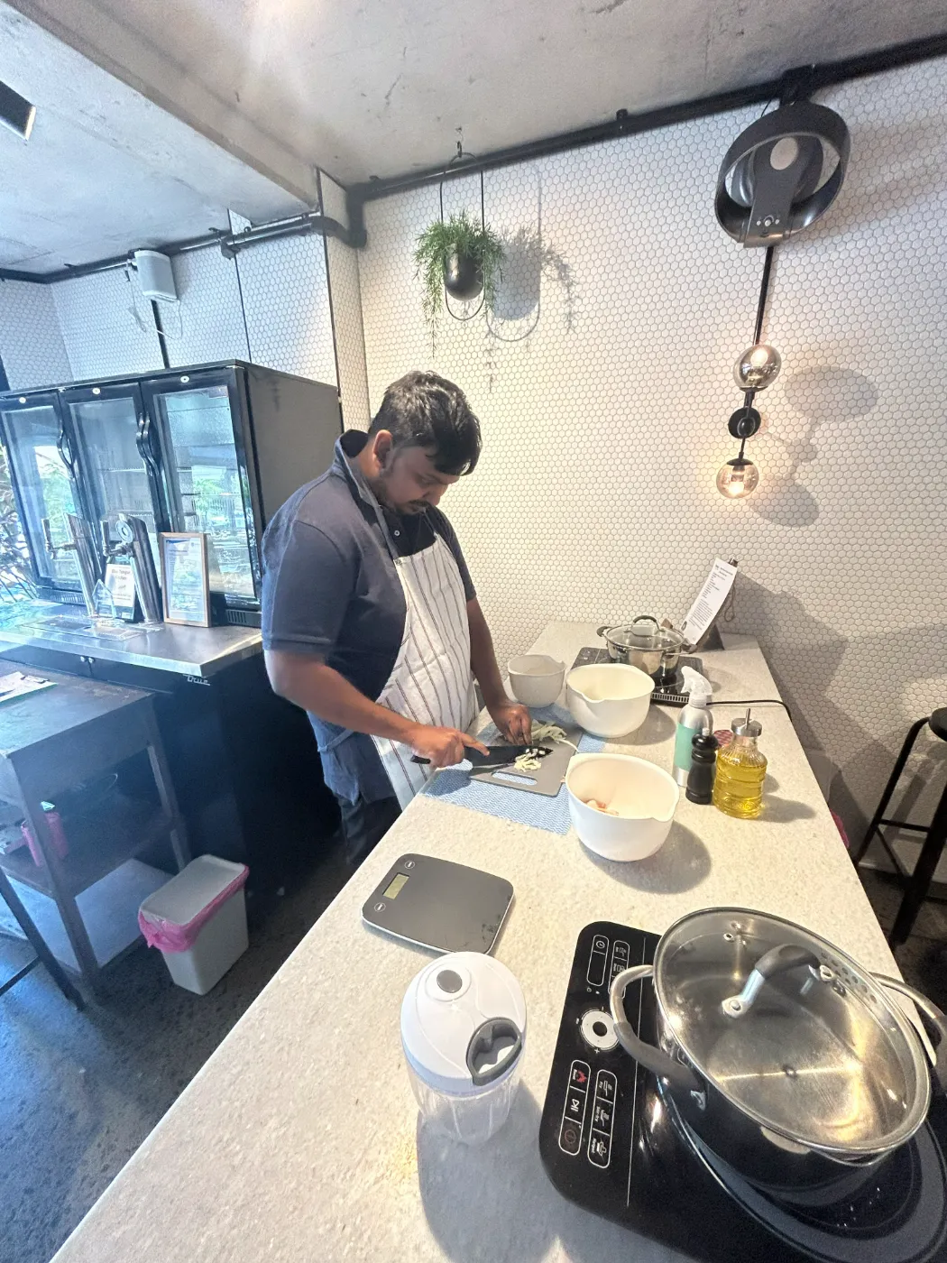 A participant preparing a meal during a cooking session