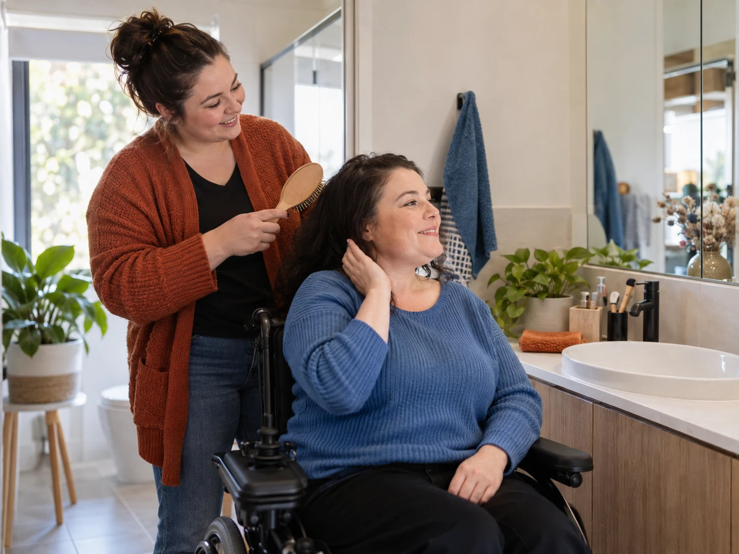 A support worker respectfully helping a wheelchair user with hair grooming at home
