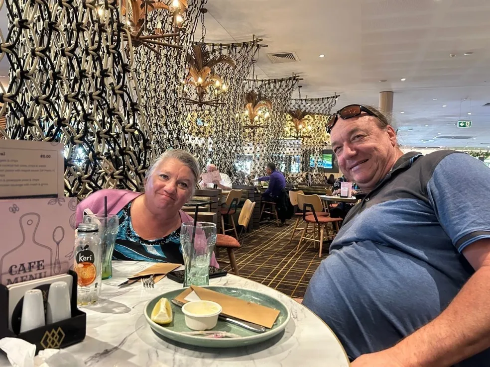Two Loving Care participants catching up over lunch at a local caf&eacute;